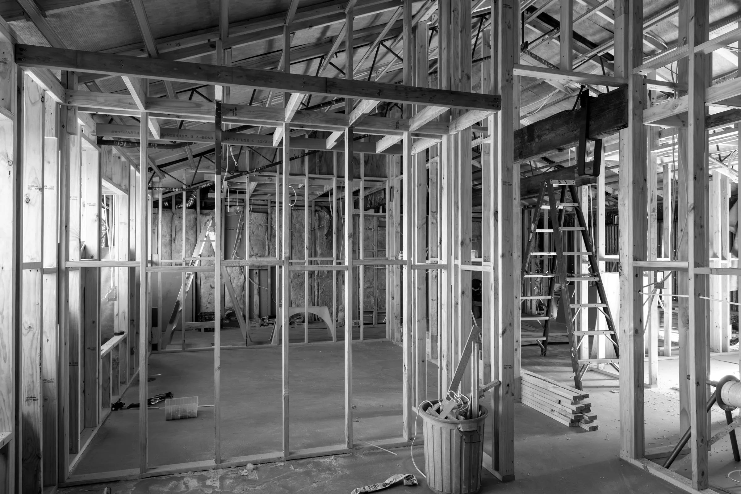 Timber wall frames standing inside a building under renovation, frame stage, Relbia