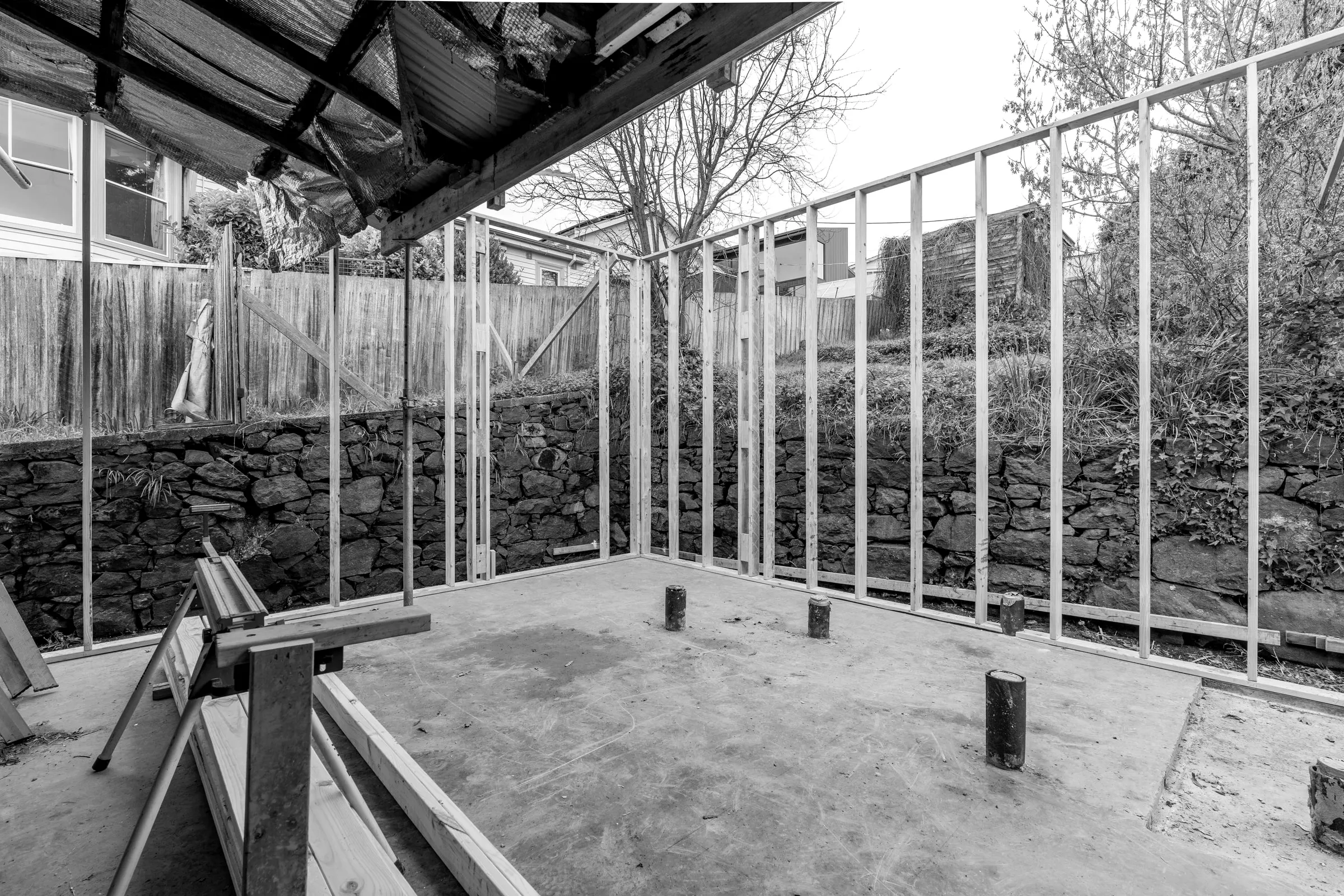 A new concrete slab with the first wall frames standing, Trevallyn